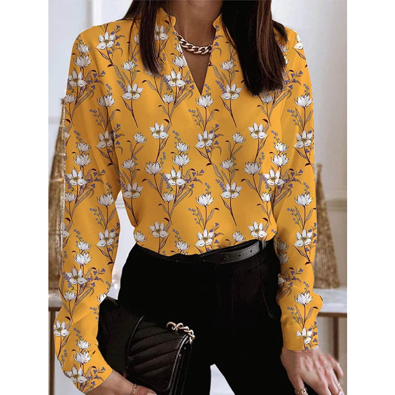 Damebluse med blomstret print og elegant krave Stilla
