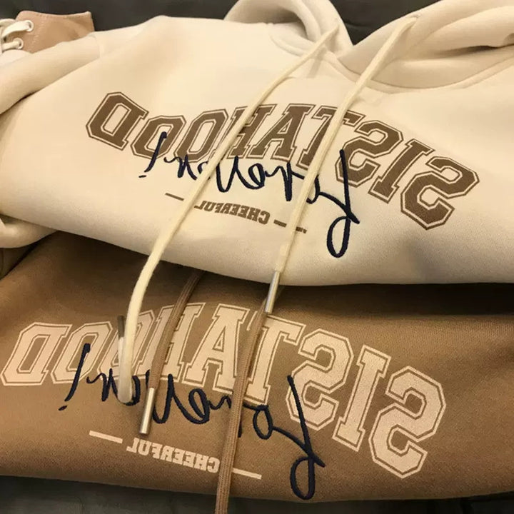 Kvinders hoodie med kreativ tekst og afslappet oversized pasform