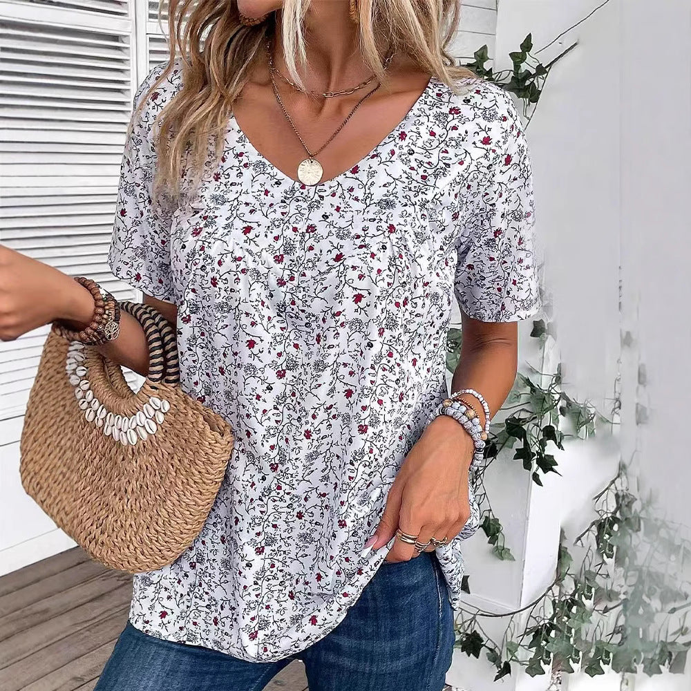 Dame nan afslappet kortærmet tunika-shirt med rund halsudskæring, delikat blomsterprint og dekorative brystfolder Skovae