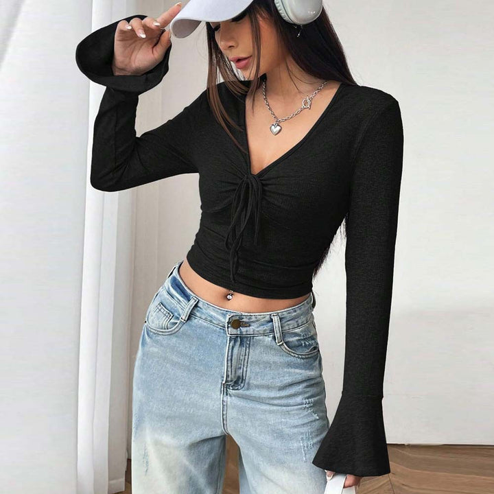 Kvinders langærmet crop top med sofistikeret knude-design Stilla