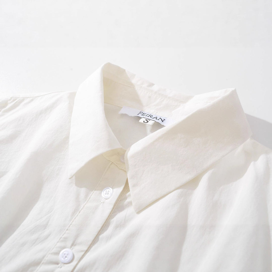 Damebluse med legende flæsedetaljer og elegant broderi Stilla