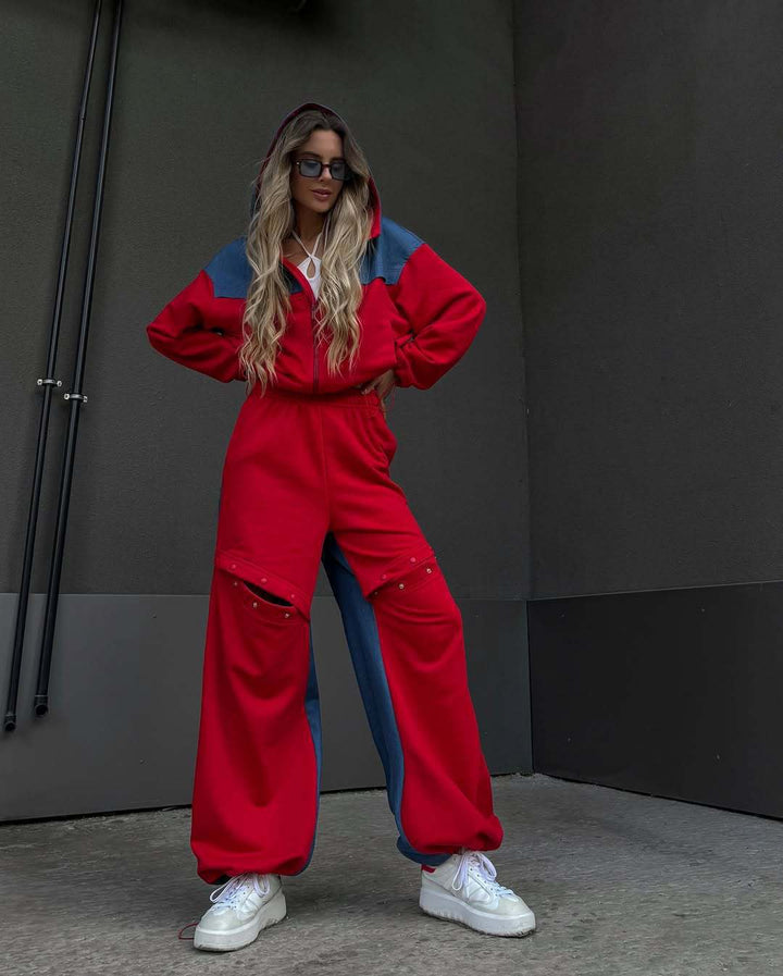 Kvinders fashionable casual outfit med sporty jakke og kreativt udskårne bukser Skovae