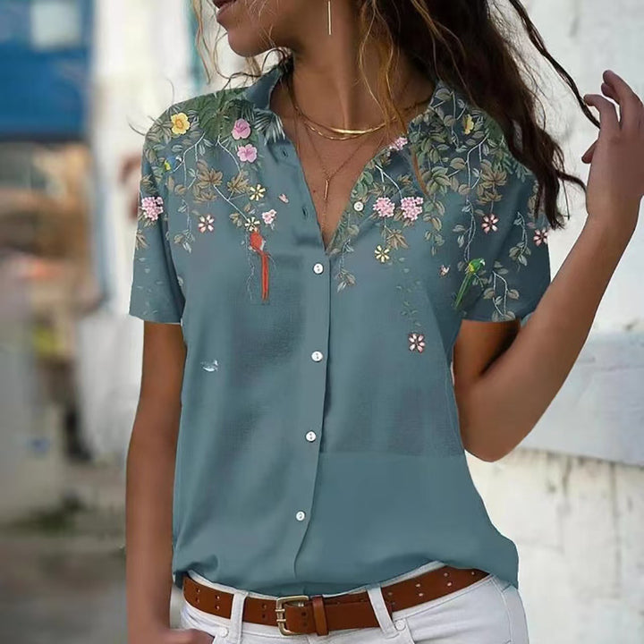 Damebluse med blomsterdesign og elegant snit Stilla