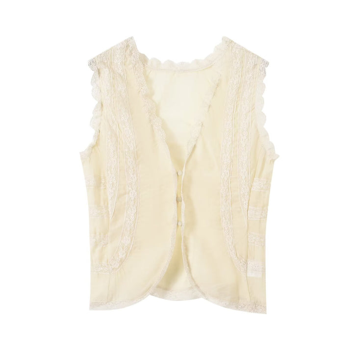 Dame-spidsen top med elegante ruffledetaljer og knaplukninger Skovae