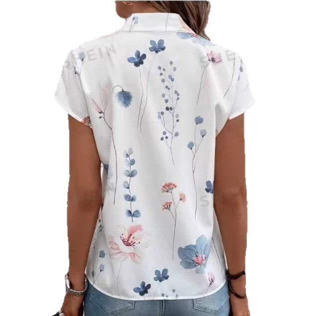 Damebluse med florale accenter og knapdetaljer Stilla