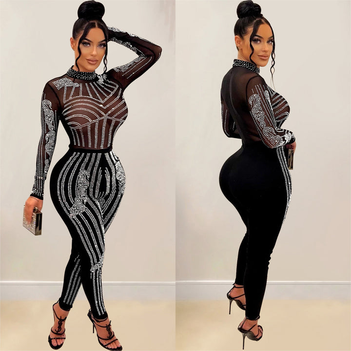Dame figursyet bodysuit med transparent mesh og glitrende strassdekorationer Stilla