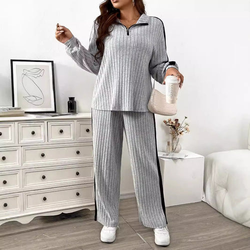 Dame elegant sportdragt med lynlås og stribet design Stilla