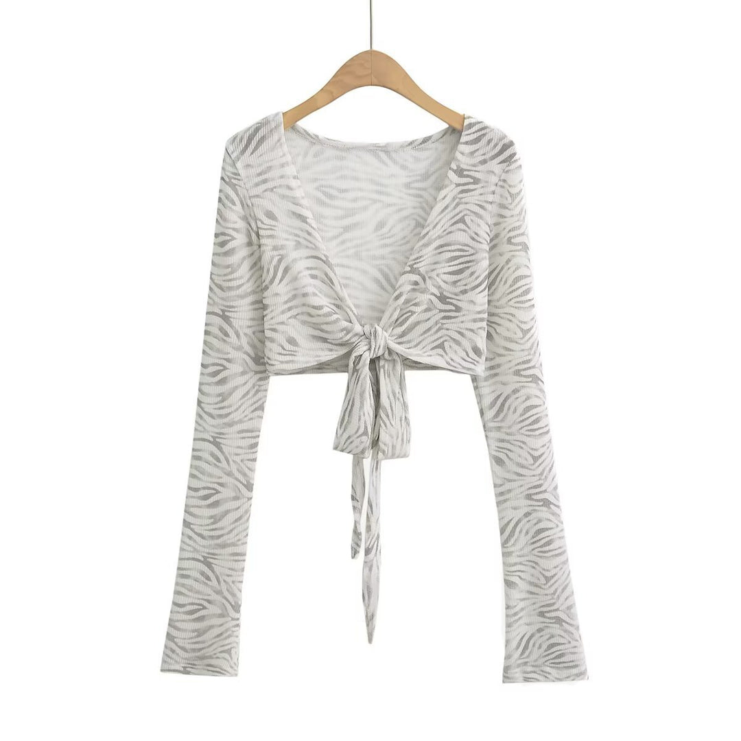 Dame cropped langærmet top med raffineret knude-design og elastisk stof Stilla