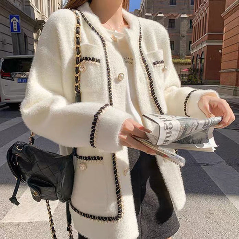 Kvindernes elegante cardigan med kontrasterende detaljer og lommer Stilla