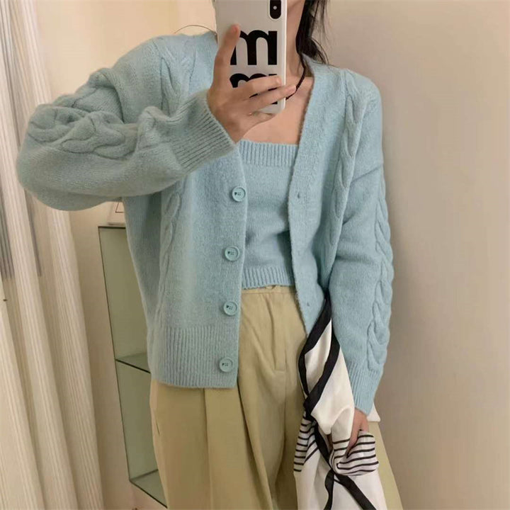 Kvinders cardigan i kabelstrikdesign med knaplukning og elegant pasform Stilla