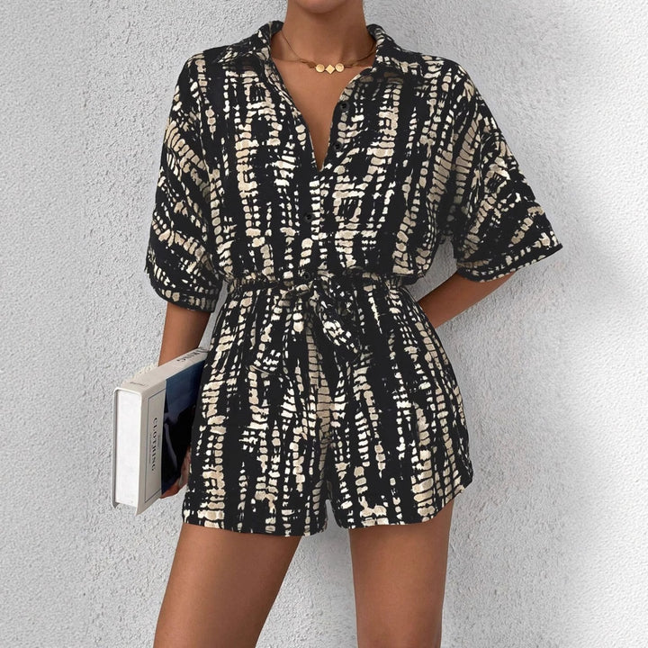 Dame kortærmet jumpsuit med blomsterprint og taljebælte Skovae