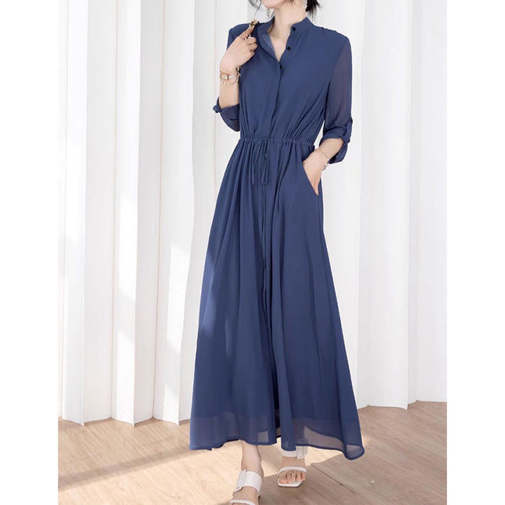 Dame stilfuld jumpsuit med elegant ståkrave og praktiske lommer Stilla