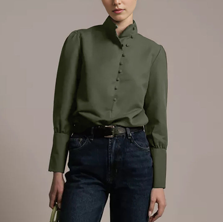 Damebluse med høj ståkrave og elegante pufærmer Stilla
