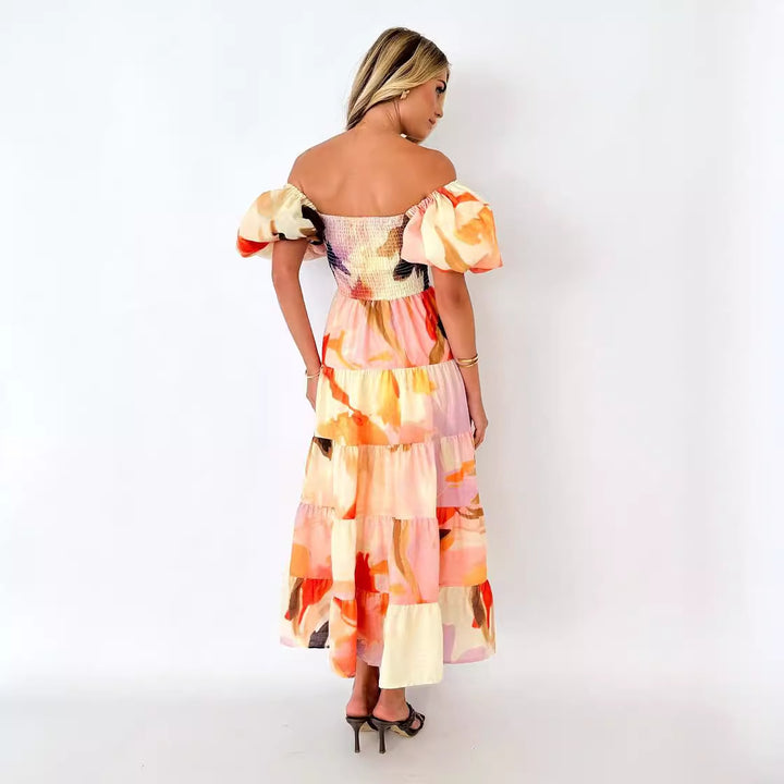 Kvinders maxikjole med off-the-shoulder design og voluminøse puffærmer Stilla