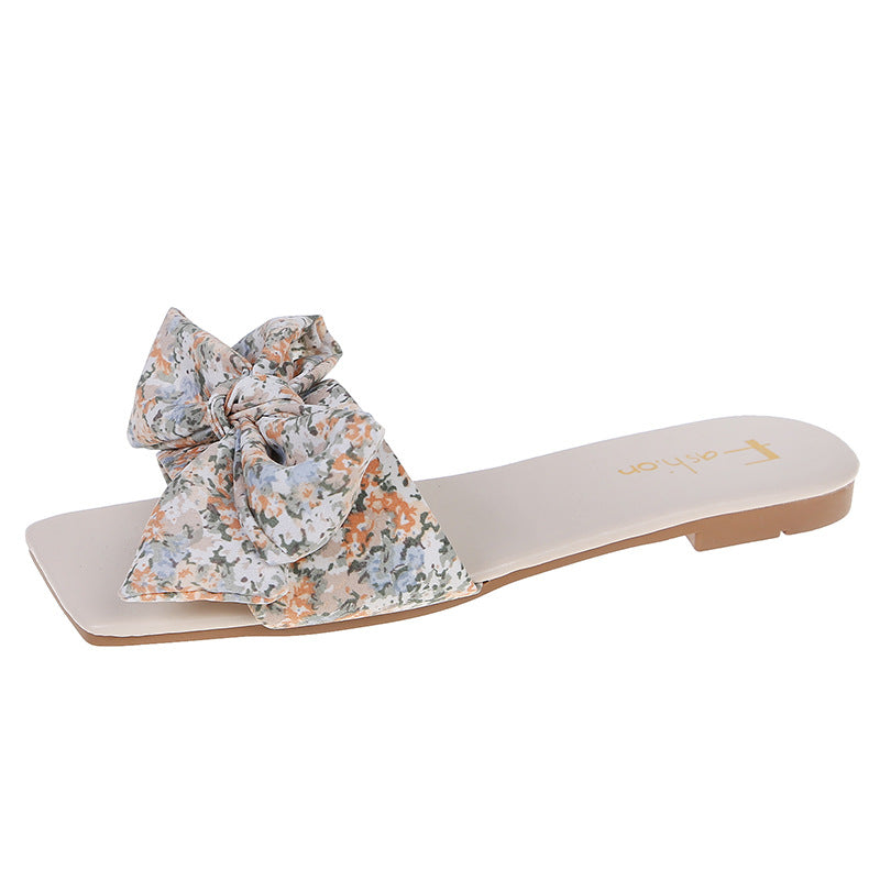 Dame slippers med stort, floralt sløjfe-design og behagelig sål Stilla