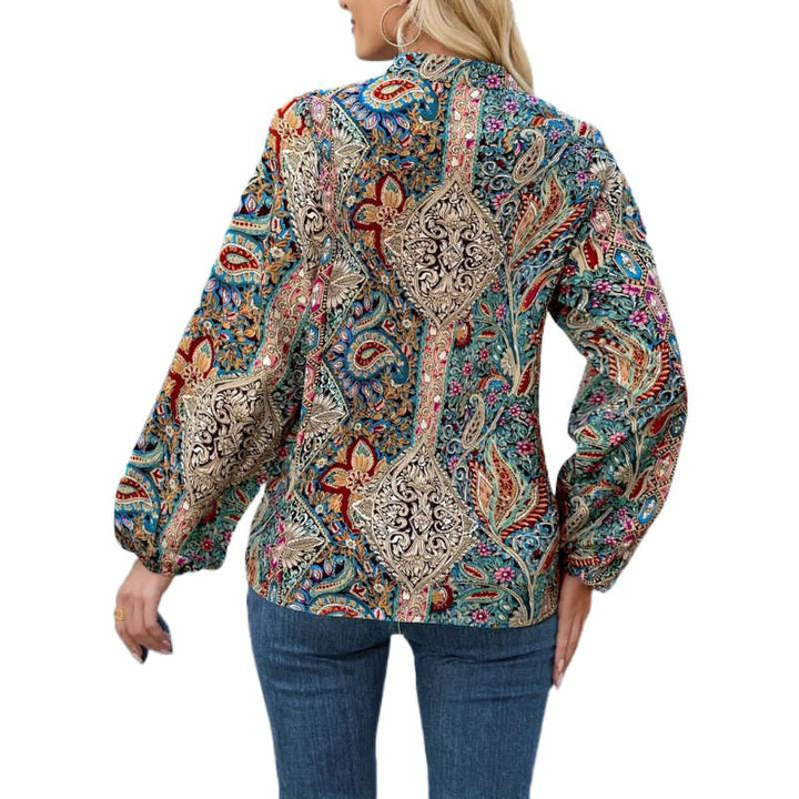 Dame elegant bluse med farverig print og ekstravagante pufærmer Skovae