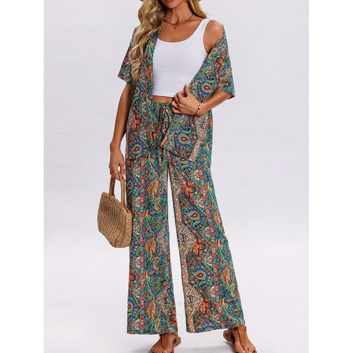 Dame kortærmet jumpsuit med flæse detaljer og bindebælte Skovae