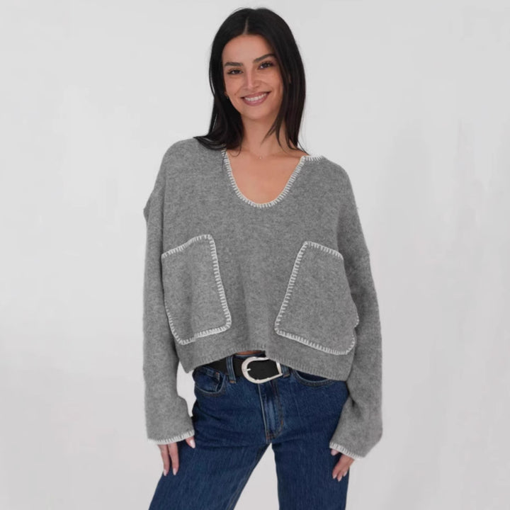 Kvinders hyggelige cropped sweater med asymmetrisk design og praktiske lommer Stilla