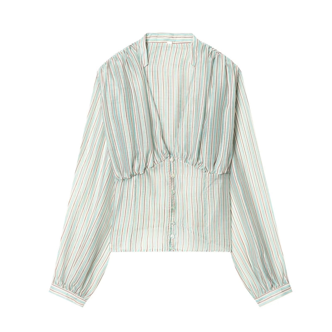 Damebluse med dyb V-udskæring og elegante ruffles detaljer Skovae