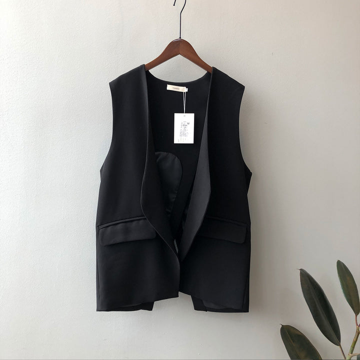 Dame elegant vest med dyb V-udskæring og praktiske lommer Stilla
