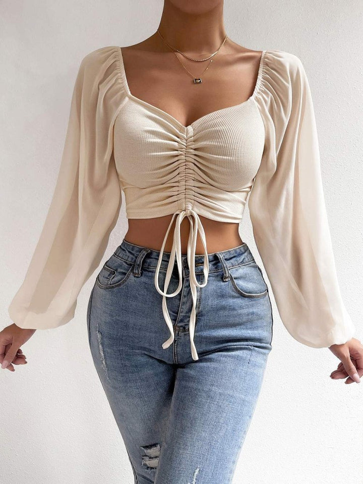 Dame Crop-Top med struktureret krop og elegante pufærmer Skovae