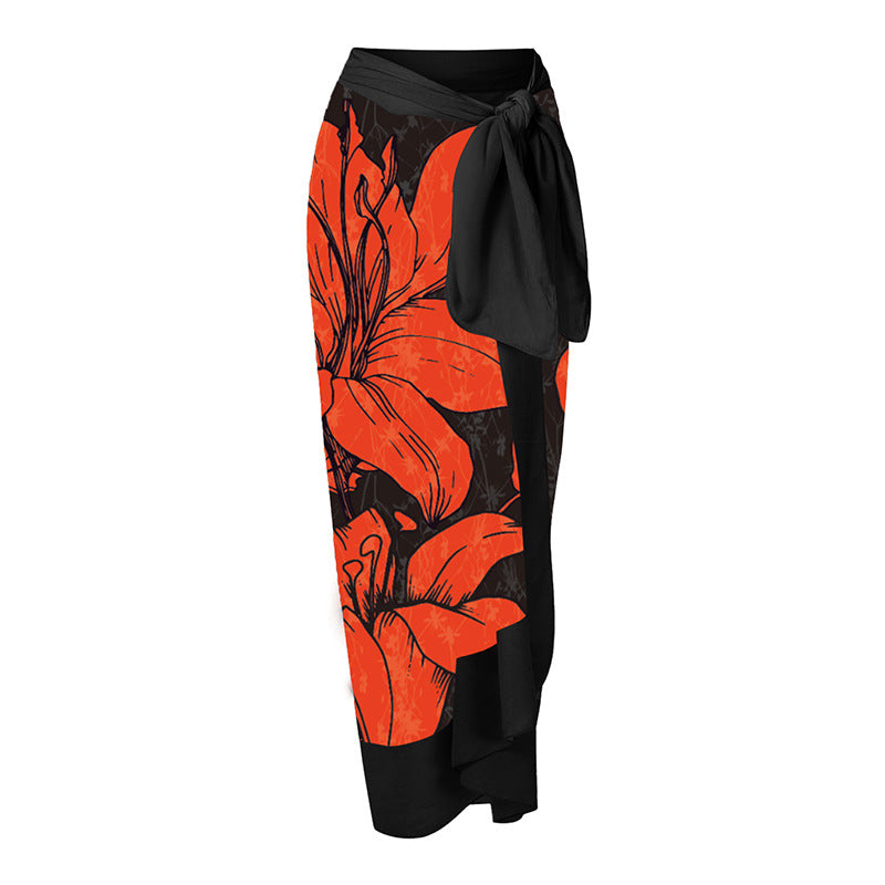 Dame badedragt med asymmetrisk snit og florale accenter Skovae