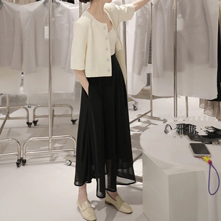 Dame elegant kort jakke med struktureret design og fashionable knapdetaljer Stilla
