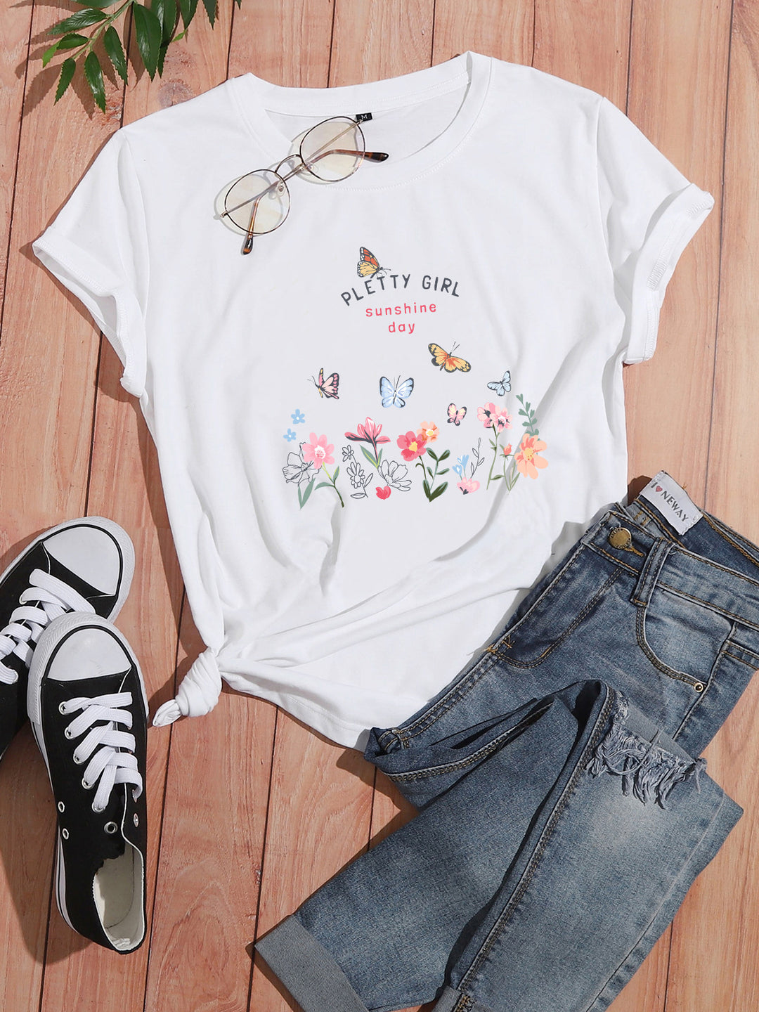 Kvinders t-shirt med legende blomsterprint og elegant print Stilla