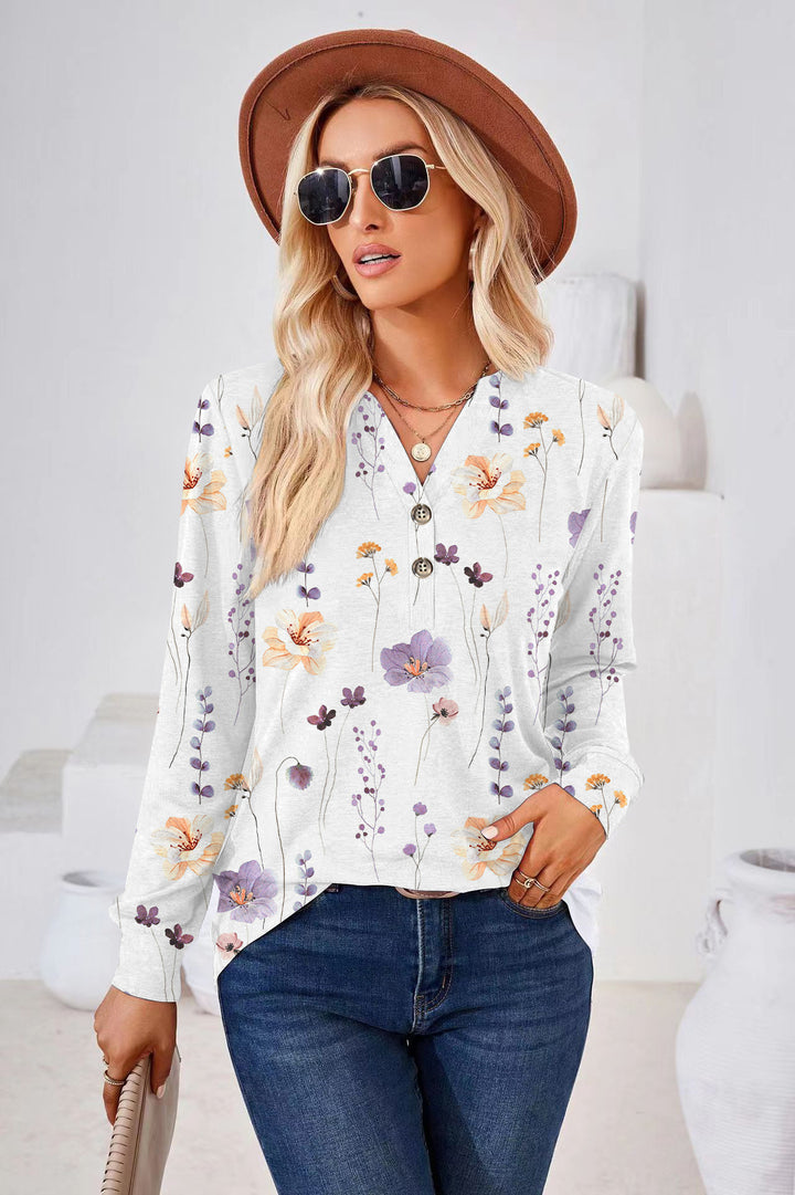 Damebluse med blomsterprint og knapdetaljer Stilla