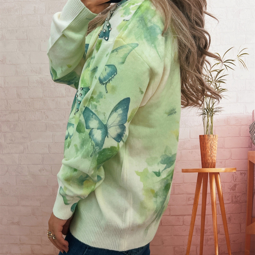 Damer strikket pullover med glitrende sommerfugleapplikationer Stilla