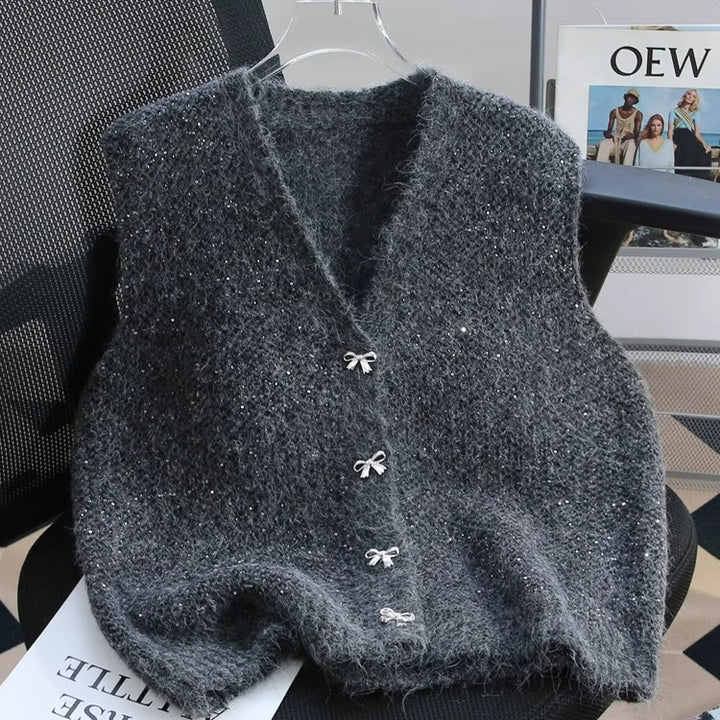 Dame strikket vest med glitrende accenter og dekorative knapper Stilla