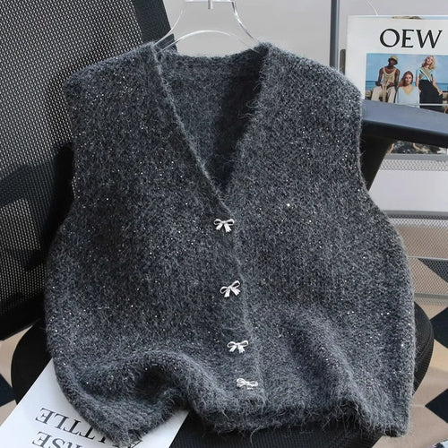 Dame strikket vest med glitrende accenter og dekorative knapper Stilla