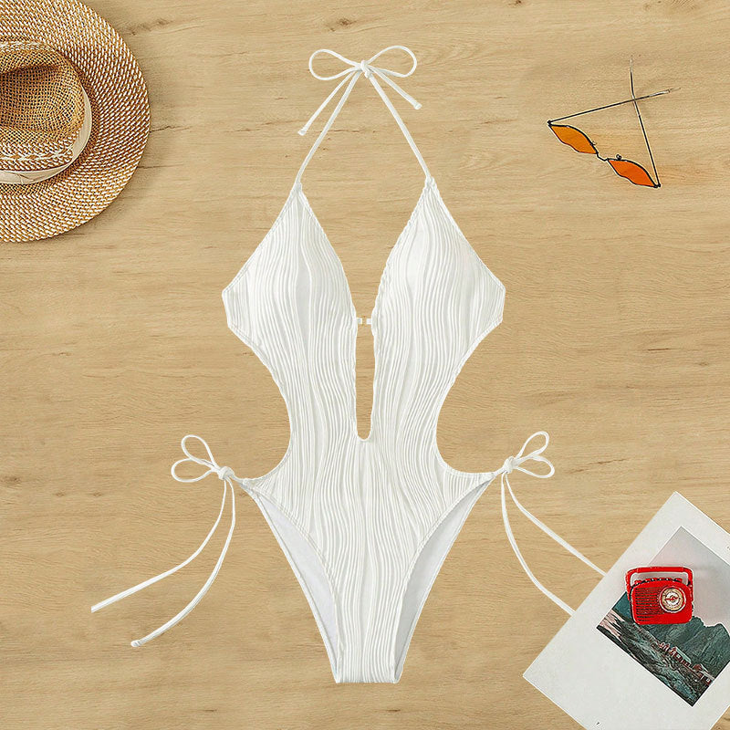 Dame én-delt badeanstik med raffinerede cut-out detaljer Skovae