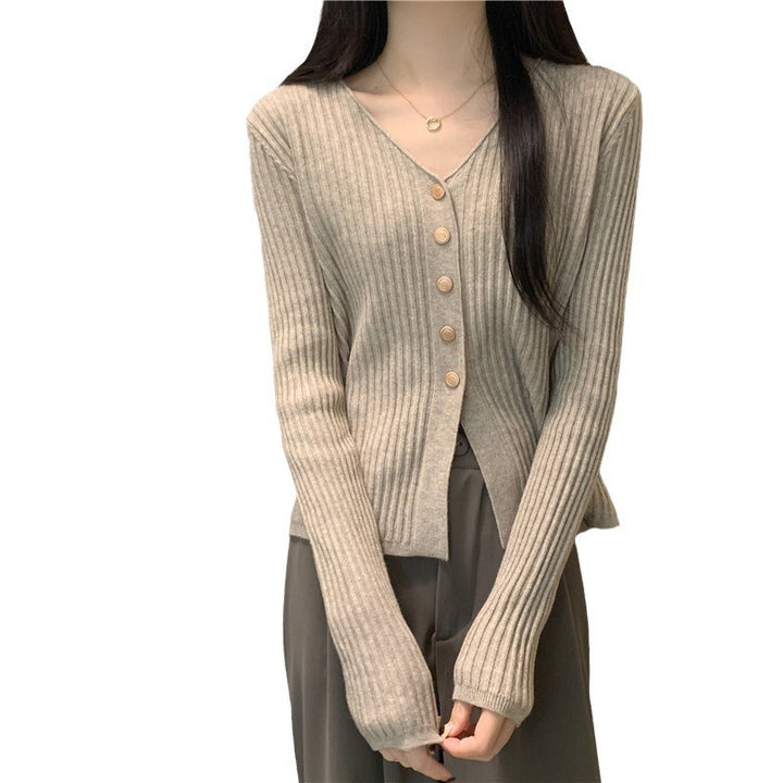 Kvinders cardigan med dekorative knapper og dyb V-hals Stilla
