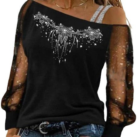 Dame top med transparente detaljer og floral strassdesign Stilla