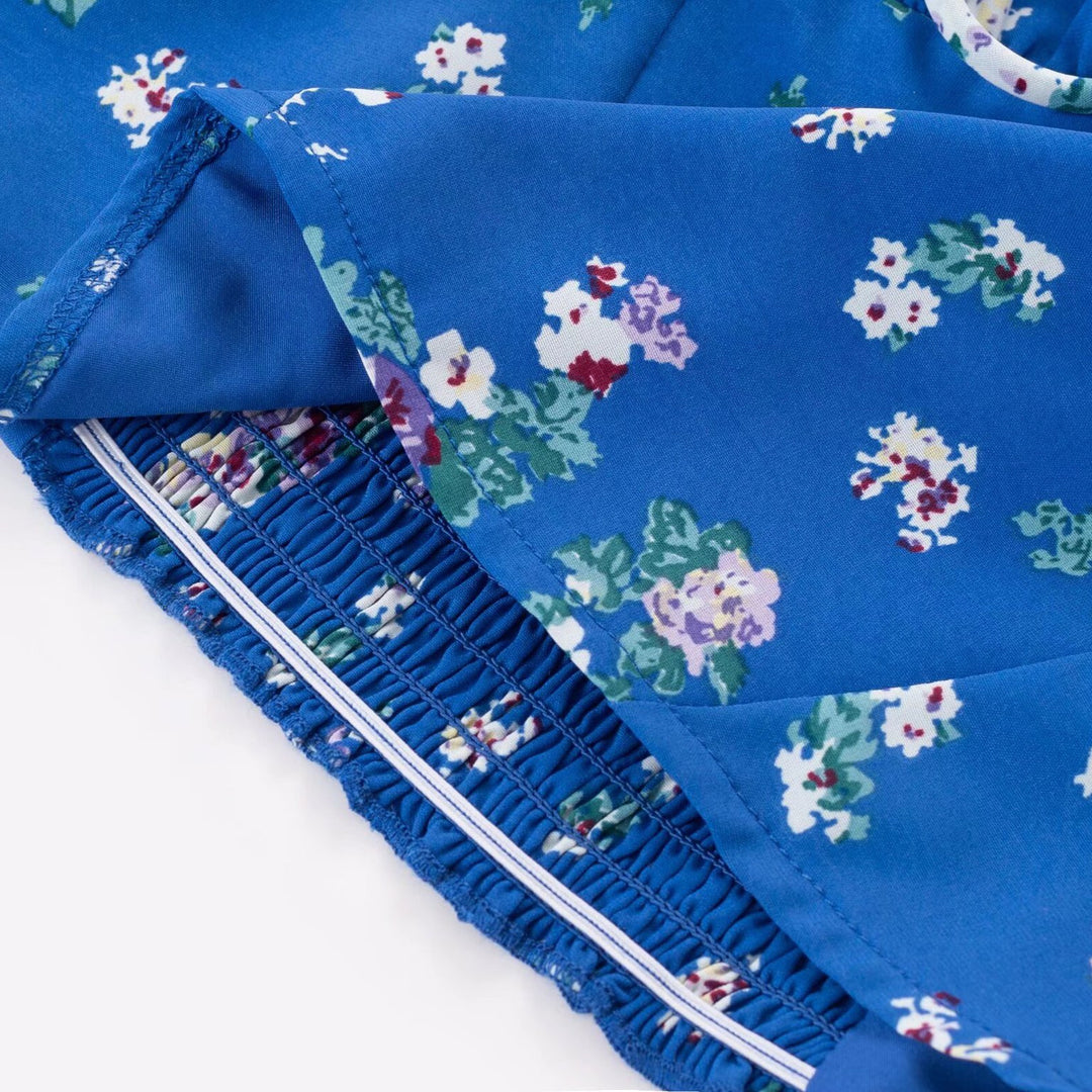 Damebluse med elastiske pufærmer og floralt design Stilla