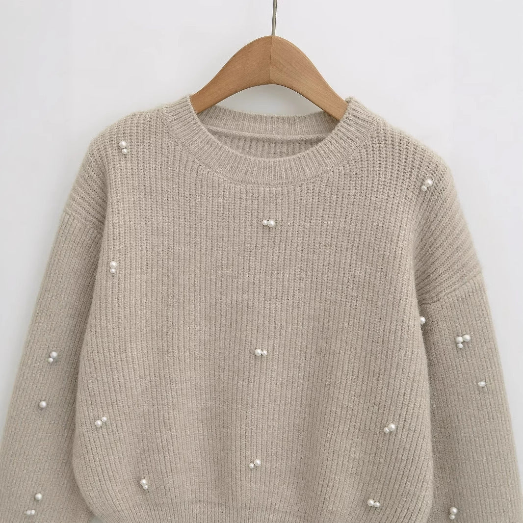 Dame modisk strikpullover med elegante perledetaljer Stilla