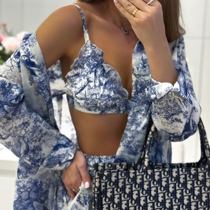 Dame top og nederdel ensemble med raffinerede flæsedetaljer og blomstret tryk Stilla