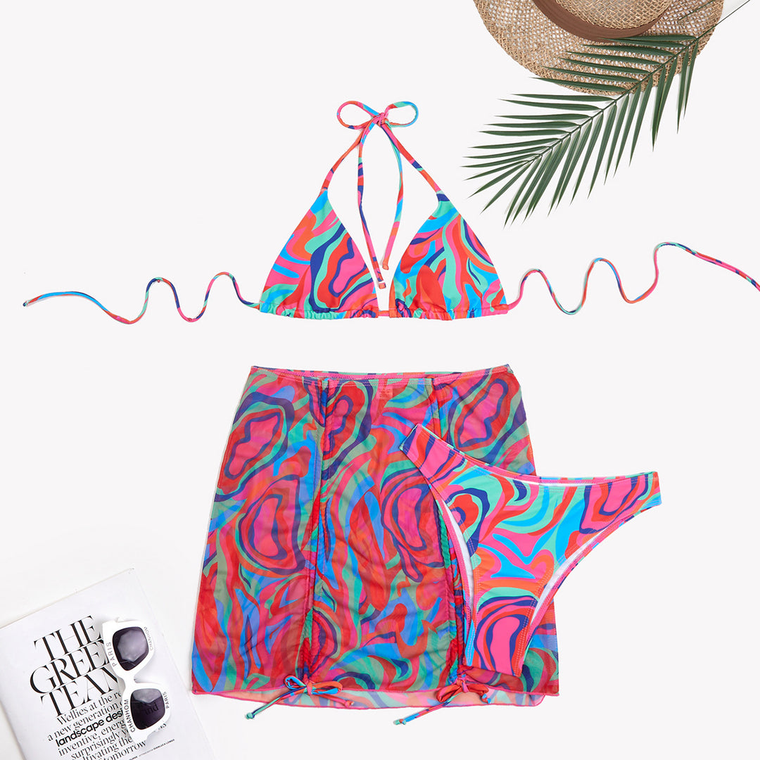 Dame trendy triangel-bikini-sæt med halvtransparent indpakningsskørt og farverigt mønster Stilla