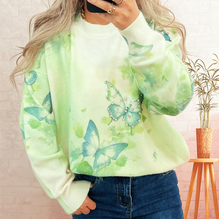 Damer strikket pullover med glitrende sommerfugleapplikationer Stilla