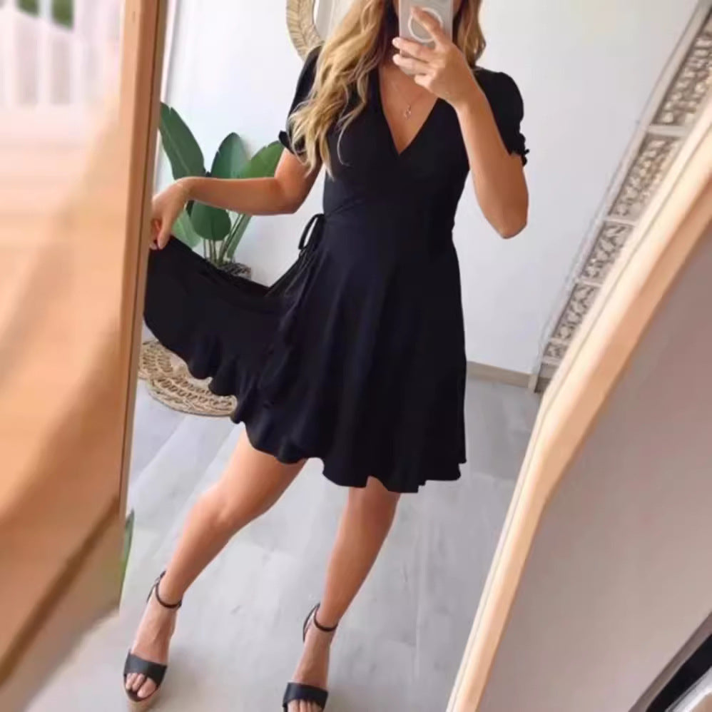 Dame wrapped dress med flydende skørt og elegante pufærmer Stilla