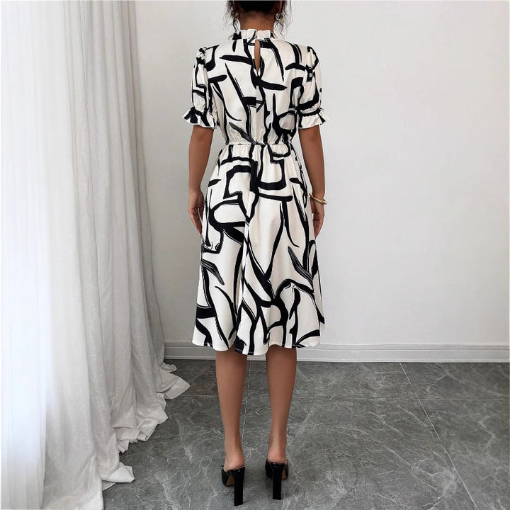 Kvinders elegante midi kjole med stilfuldt plante mønster og elastisk talje Stilla