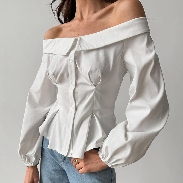 Damebluse med asymmetrisk udskæring og voluminøse ærmer Stilla
