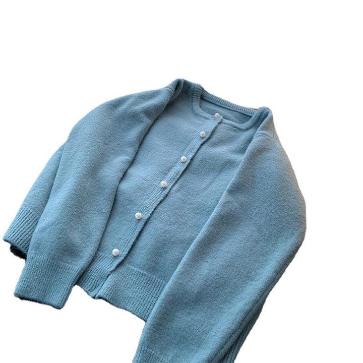 Kvinders cardigan med elegante perleknapper og moderne design Stilla