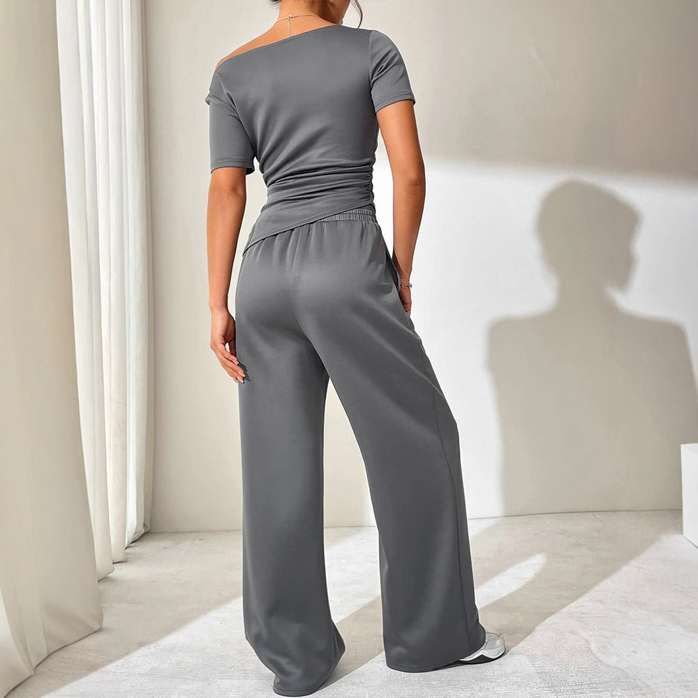 Dame jumpsuit med asymmetrisk snit og bredt skåret ben Skovae