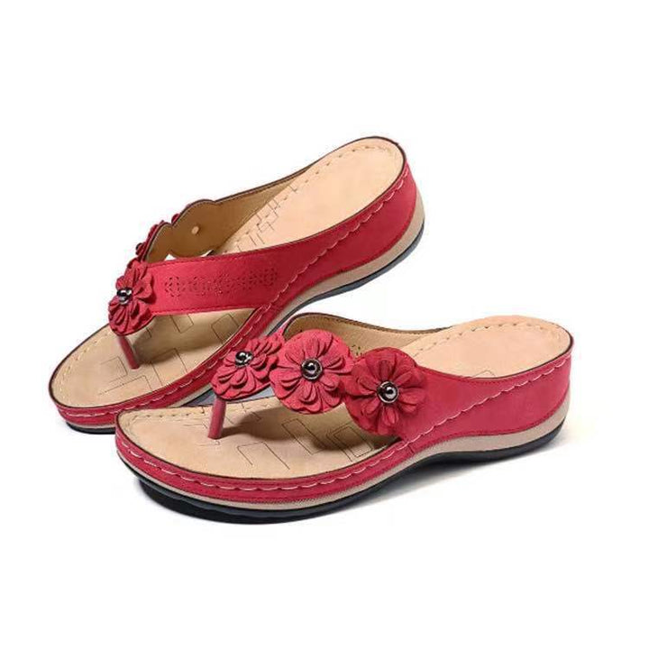 Dame slip-in sandaler med elegante blomsterapplikationer og ergonomisk sål Stilla