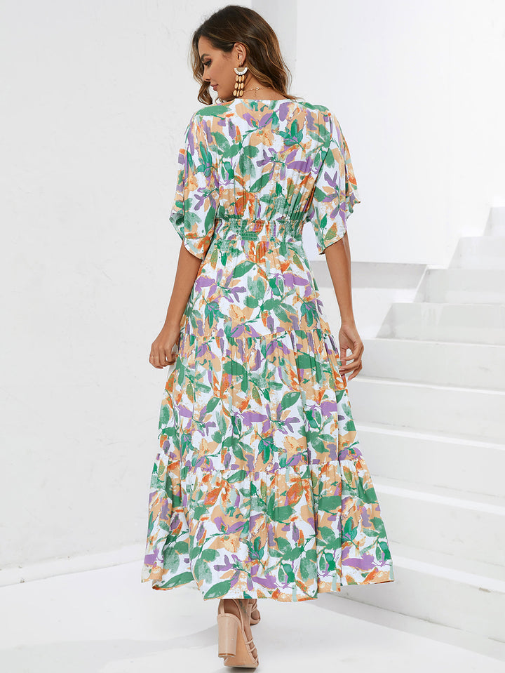 Dame maxikjole med blomsterdesign og buet kant Stilla