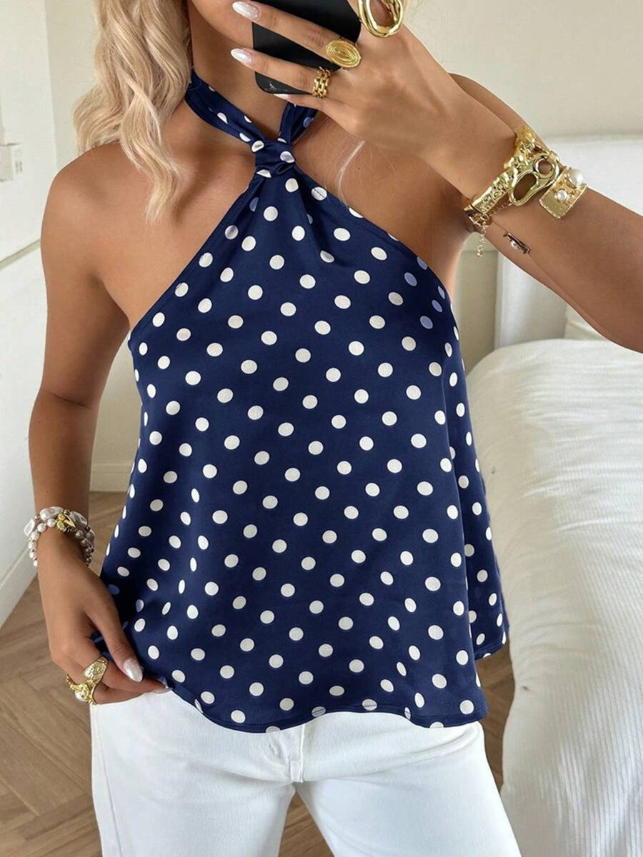 Dame Elegant top med et off-shoulder design og legende prikkemønster Skovae
