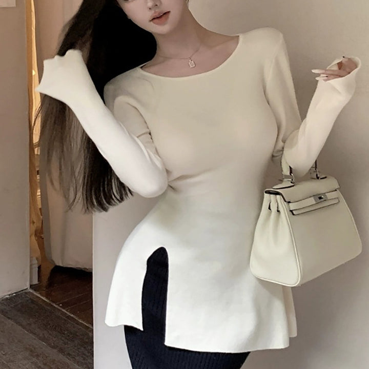 Kvinders langærmet top med asymmetrisk snit og elegant detalje