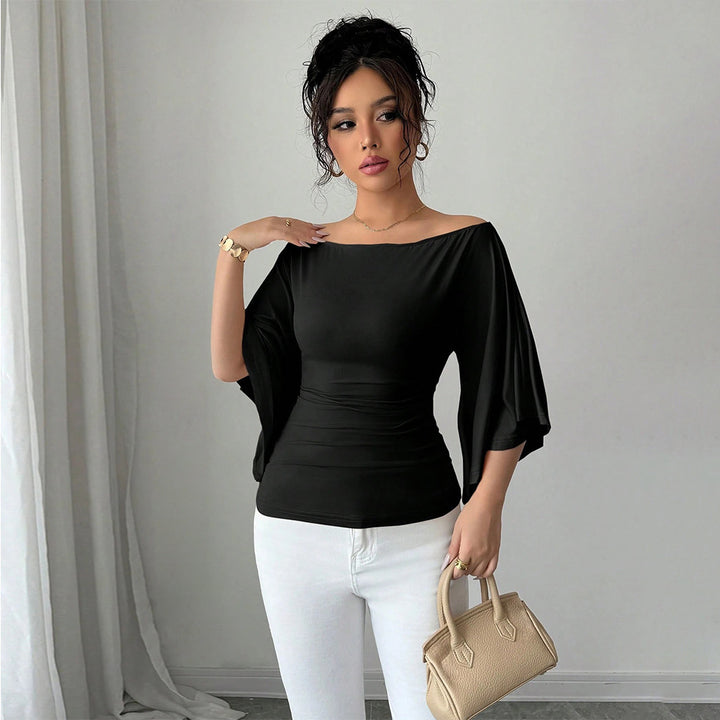 Kvinders elegante off-shoulder top med brede ærmer og figursyet pasform Stilla